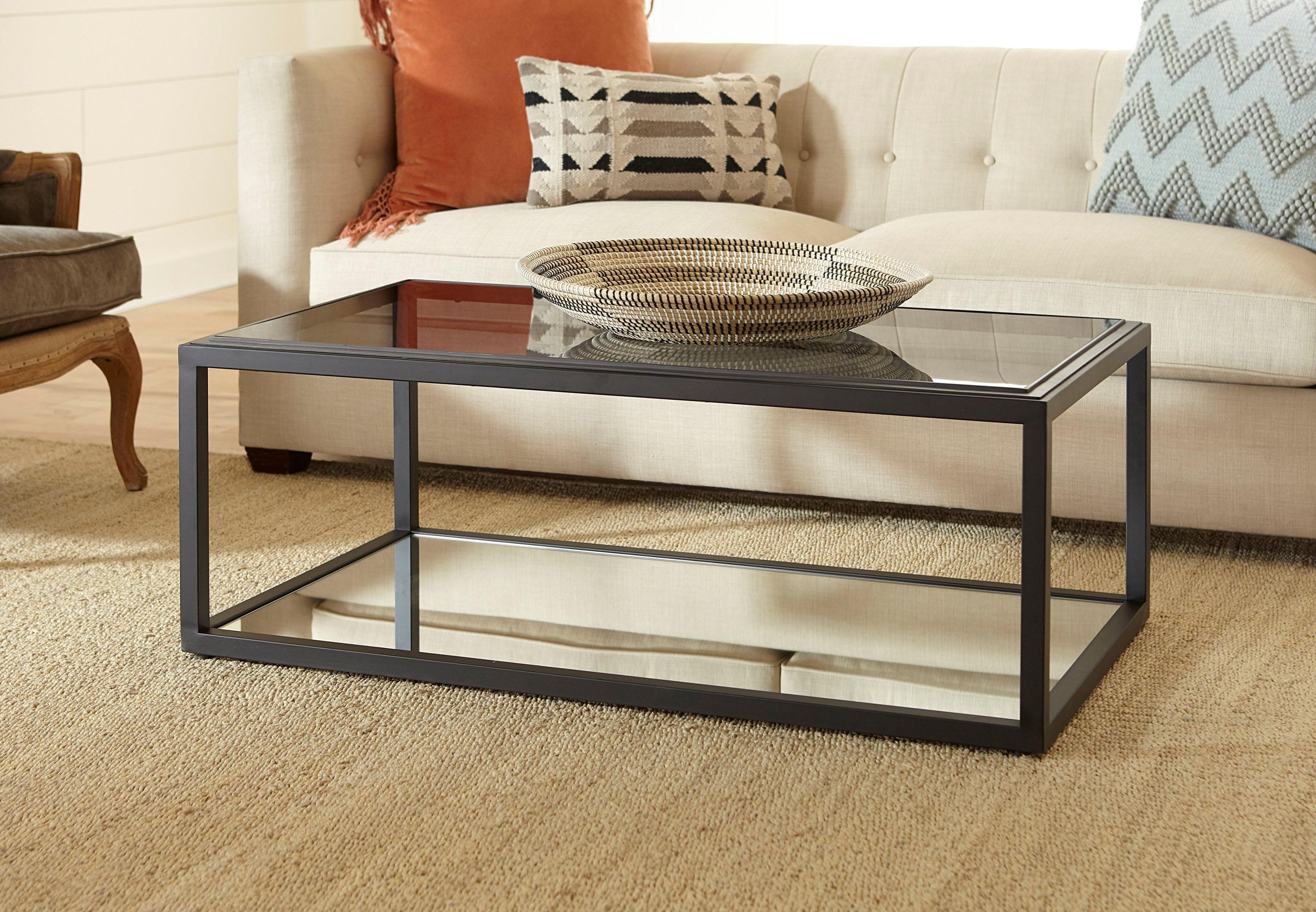 

    
Black Ink Finish Glass Top & Mirrored Shelf Coffee Table ELLIS by Modus Furniture
