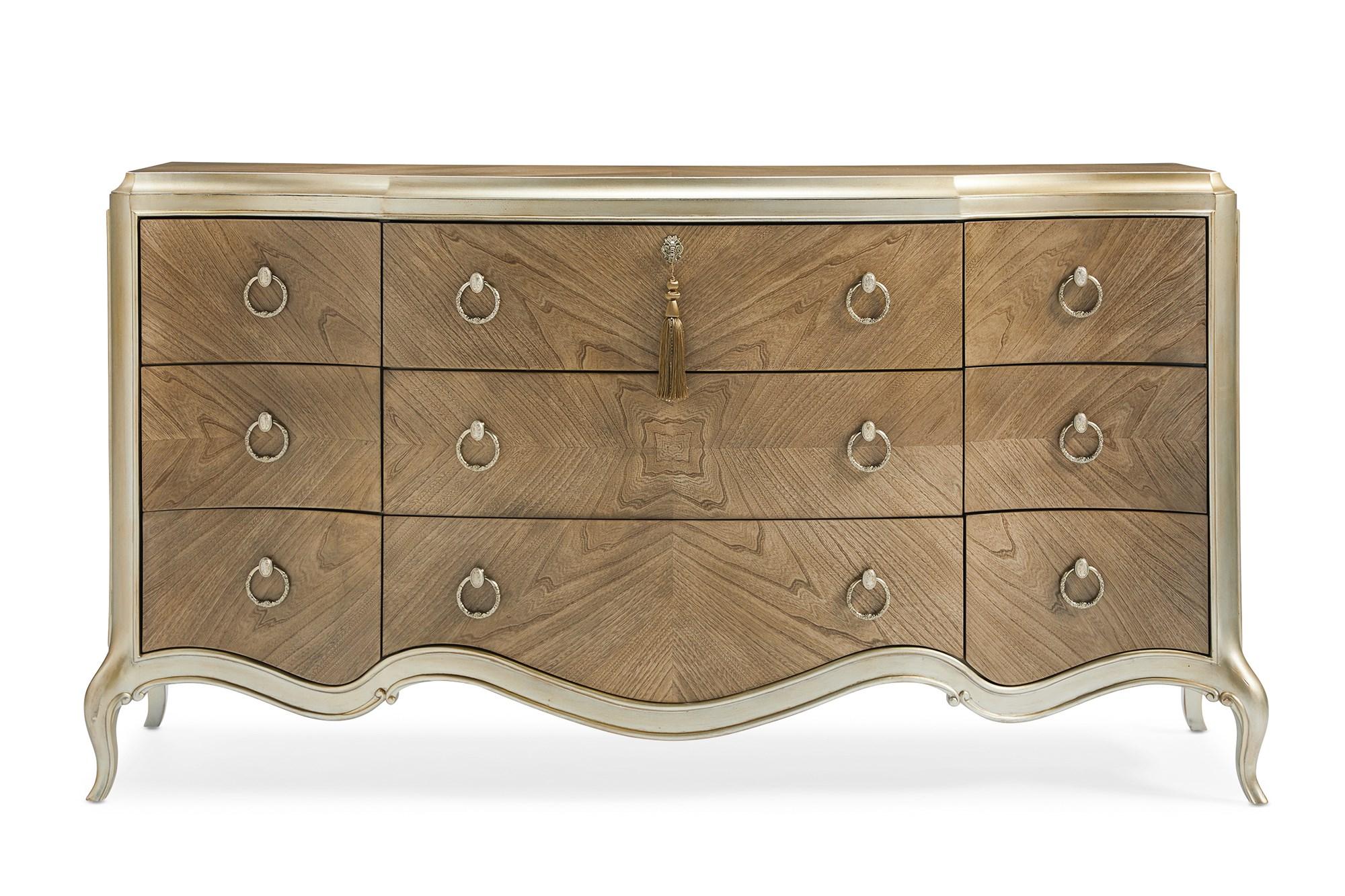 

    
Cendre & Champagne Mist 9 Drawers Triple Dresser FONTAINEBLEAU by Caracole
