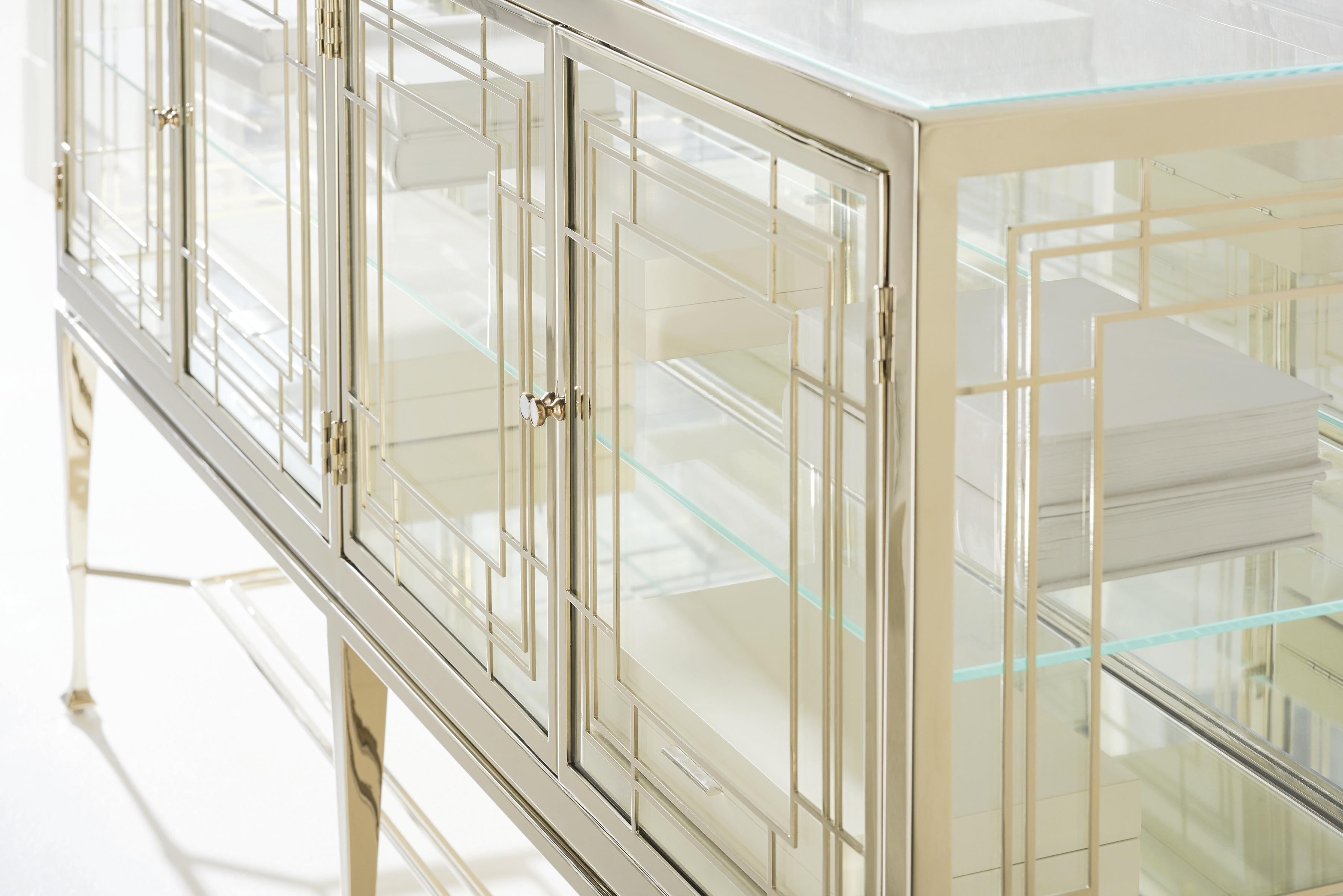 

    
Clear Glass & Whisper of Gold Finish Cabinet WORTH ITS WEIGHT IN GOLD by Caracole
