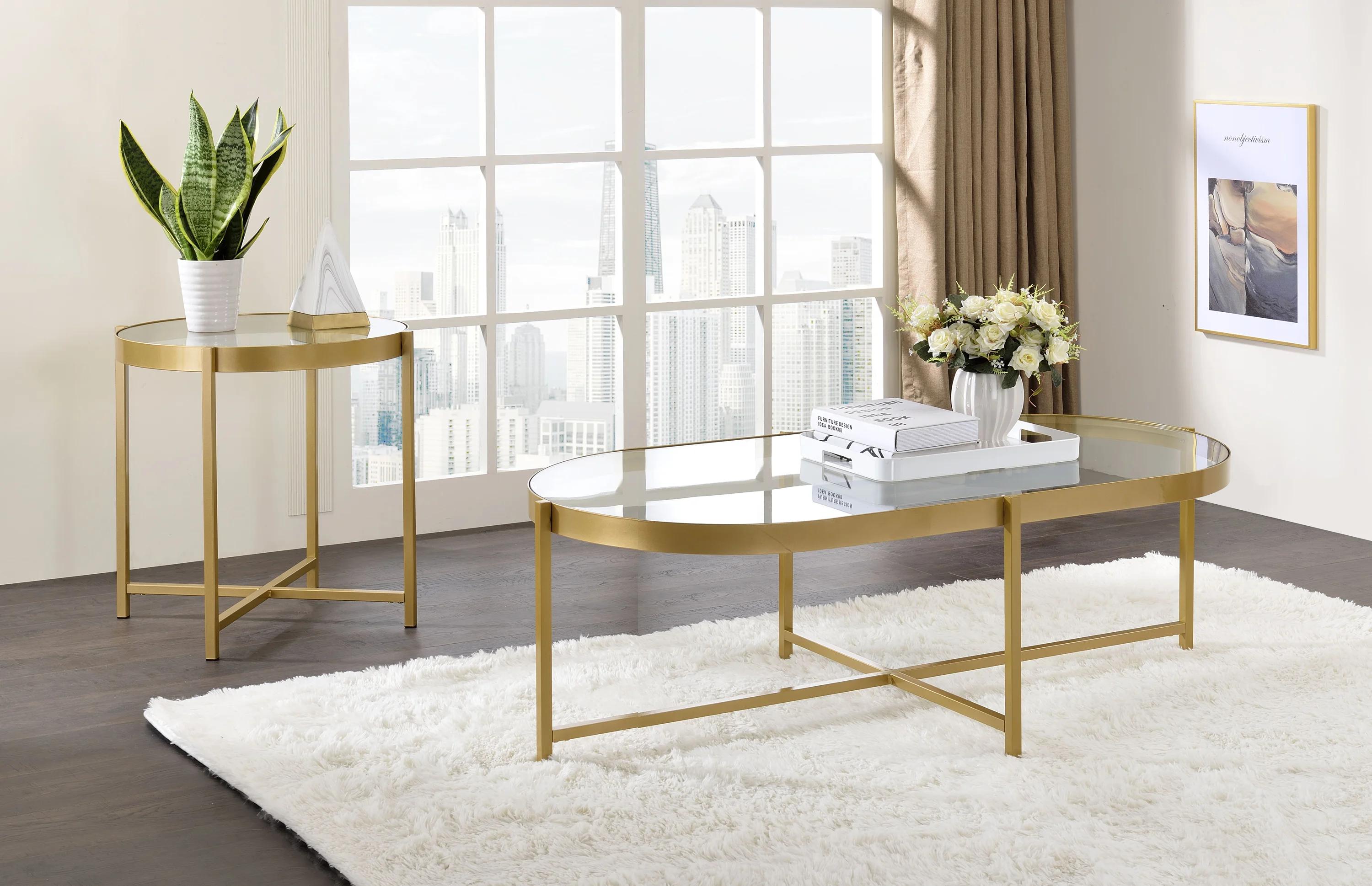 

    
Contemporary Clear Glass & Gold Finish Coffee Table + 2 End Tables by Acme Charrot 82305-3pcs
