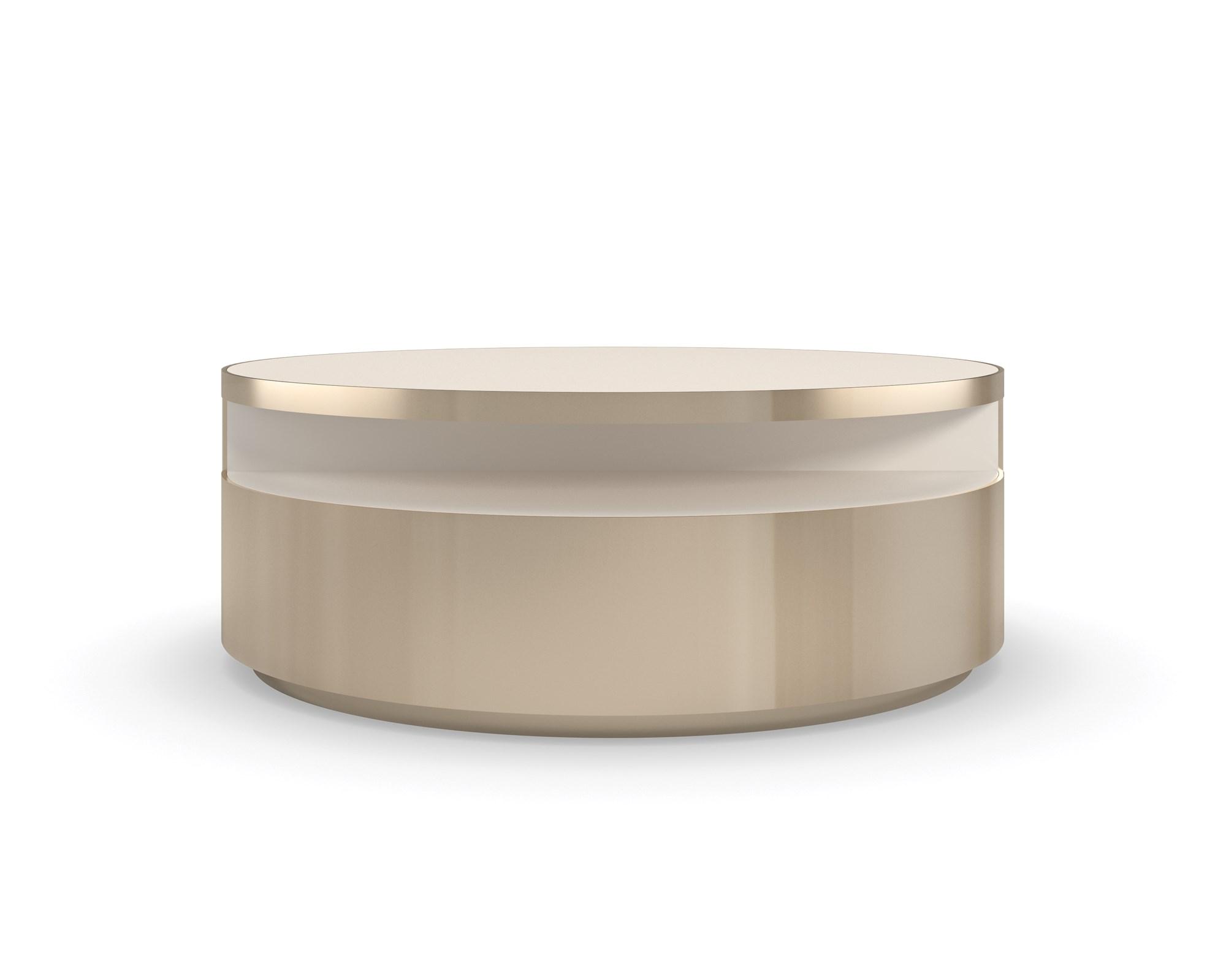 

    
Crème Stone W/  Soft Gold Tone Swivel Base Coffee Table TURN STYLE by Caracole
