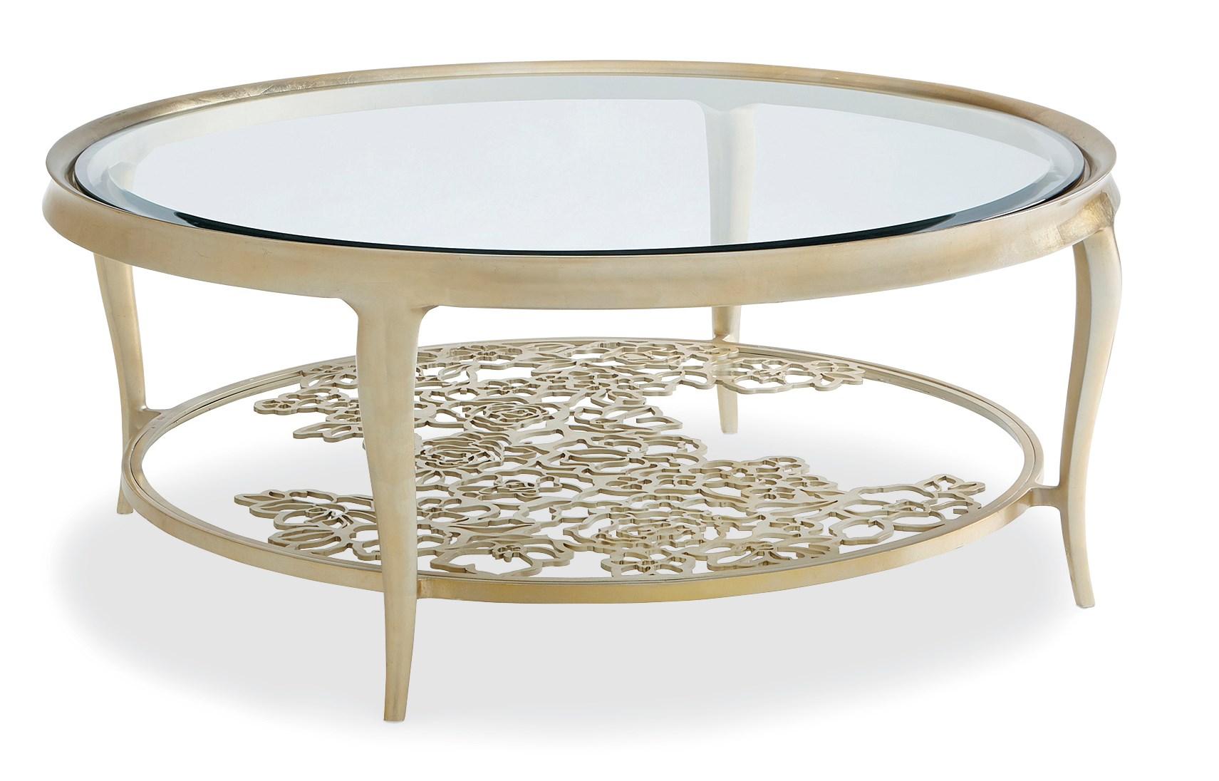 

    
Gold Metal Frame W/ Cutout Flowers Round Coffee Table HANDPICKED by Caracole
