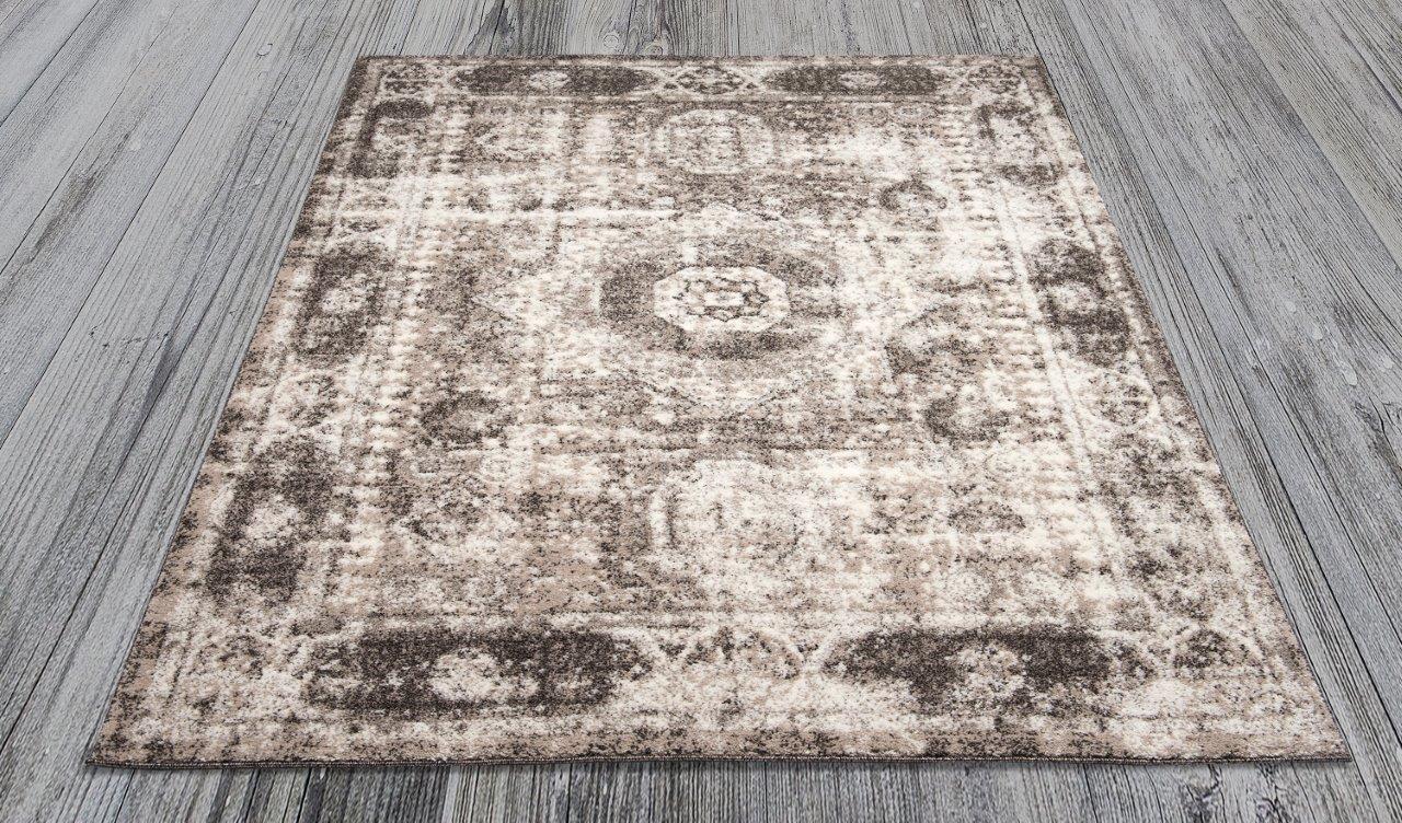 

    
Ramona Brown and Beige Border Medallion Area Rug 5x8 by Art Carpet
