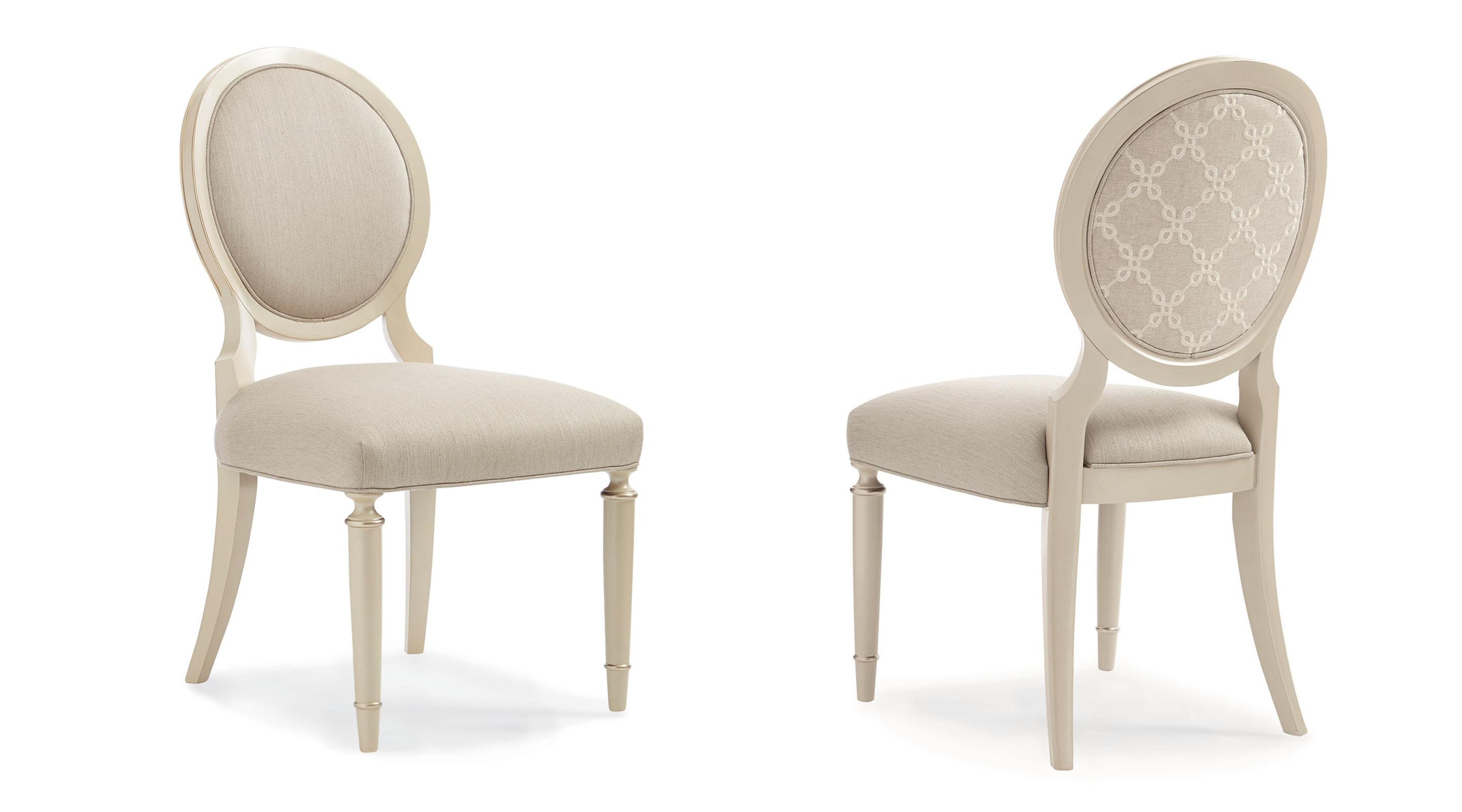 

    
Soft Silver Leaf Finish Upholstered Pearl Dining Chair Set 2Pcs CHITTER CHATTER by Caracole
